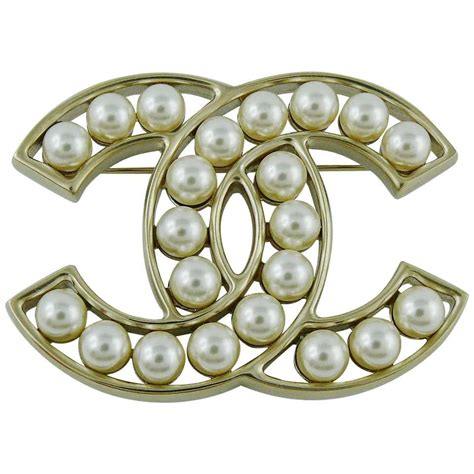 chanel pearl cc brooch|chanel pearl brooch price.